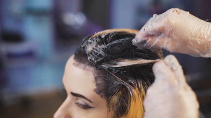 A radical change of hair color. Attractive blonde woman in a beauty salon