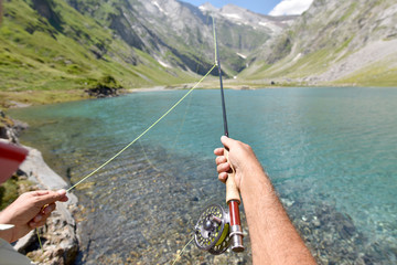 Closeup of fisherman holding fishing rod