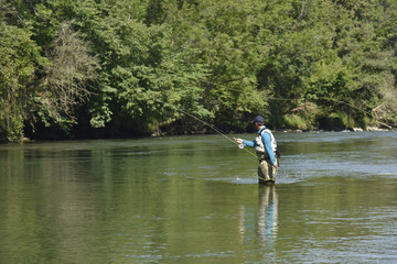 Fototapeta na wymiar Flyfisherman fishing in mountain river
