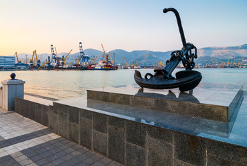 NOVOROSSIYSK, RUSSIA - JULY 7, 2010: Anchor on the embankment and a view of  the port of...