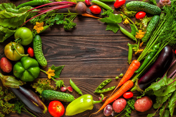 Fresh organic Vegetables on Wooden Background. Healthy Vegetarian food, View from above.