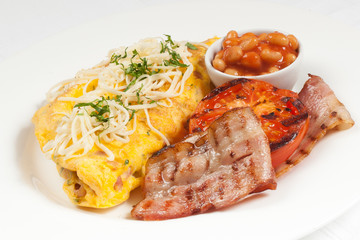 Traditional english breakfast with beans, ham, omlette, tomato a