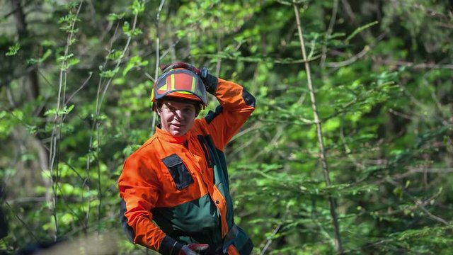 A young logger is letting go a heli into the air. It will know record a few videos. Close-up shot.
