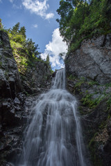 Fototapeta na wymiar Waterfall in the mountains