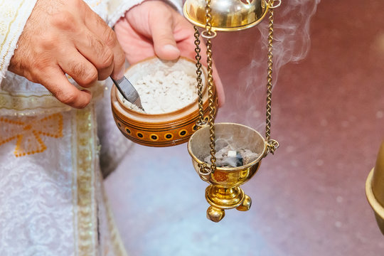 priest singing in a christian sermon censer church rite foog