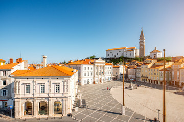 Tartini main square with church tower in Piran town at the morning in Slovenia
