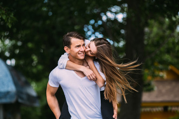 Young adult brunette man and woman in the park