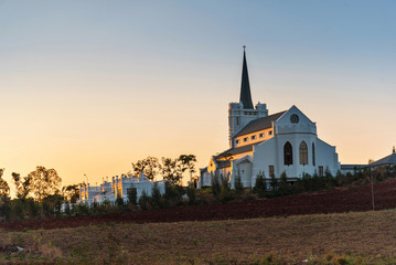 beautiful sunrise view of church on a hill