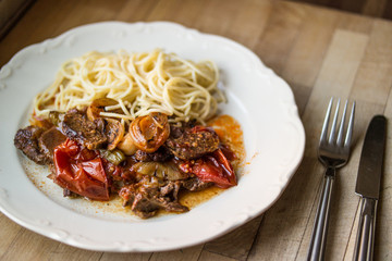 Beef with sphagetti.