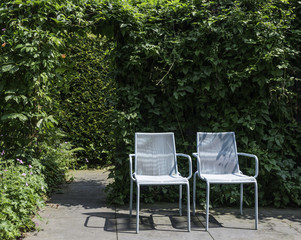 two blue seats in garden