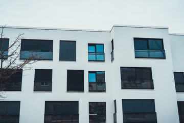 White building with dark windows