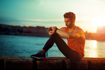 Muscular man during his workout outdoors