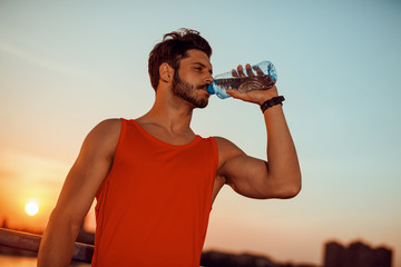 Sport man drinking water
