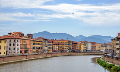old architecture and river Arno, Pisa, italy
