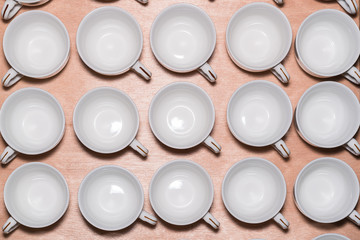 Many rows of white coffee cup 

