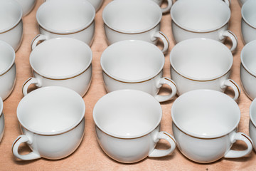 Many rows of white coffee cup 
