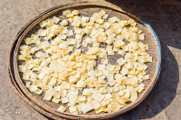 Asian street market selling raw pasta dough in Vietnam