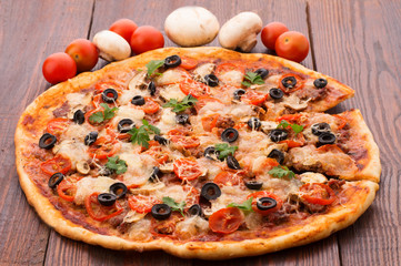 Pizza with ham, pepper and olives