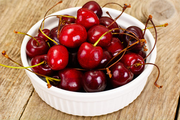 Fresh Cherry in Wooden Bowl