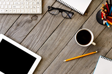 Designer working desk with Tablet, Coffee, Keyboard, Notebook, C