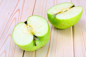 Green Apple on Light Wooden Background