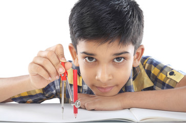 Indian boy with drawing compass