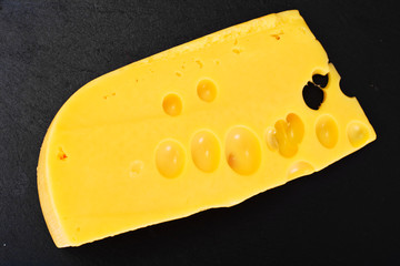 Swiss Cheese Isolated on Black Background