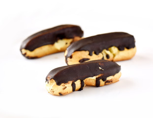 chocolate eclairs on white background