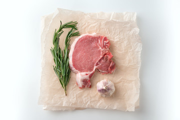 Raw pork cutlet with spices for grill or cooking on white background
