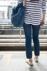 Back view of woman wearing jeans.