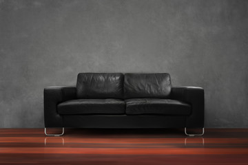 black sofa with wooden floor dark green concrete wall in empty living room interior