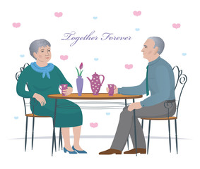 Fototapeta premium Elderly, retirement age couple sitting at a table in a cafe and drinking tea. Isolated on white background, concept happy family.