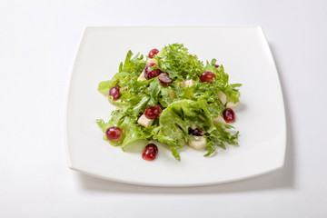 Fresh salad of lettuce with sweet sauce with pieces of fruit