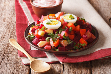 Finnish rosolli salad of boiled vegetables and cream sauce close-up. horizontal
