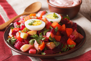 Finnish rosolli salad and cream sauce close-up. horizontal
