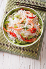 Thai salad with glass noodles, prawns and peanuts close-up. vertical top view   © FomaA