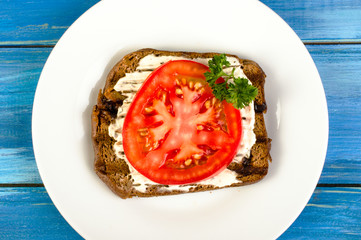 Sandwiches with tomatoes and herbs.