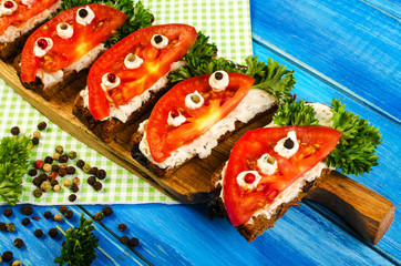 Vegetarian sandwiches with tomatoes and herbs.