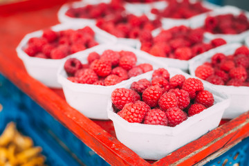 Yummy Red Berries Raspberries At Market In Trays