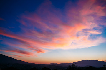 Colorful Sunset, Sunrise  over Mountains Background. Blue, Red, 