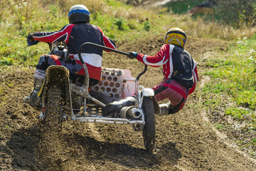  Motorcycle with sidecars overcomes steep turn