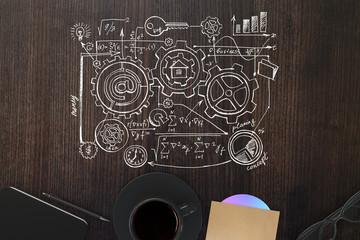 Wooden desktop with business sketch