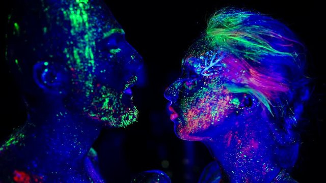 The tenderness of the couple ultraviolet light. Fluorescent powder.