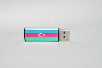 usb flash drive with the national flag of azerbaijan on gray background