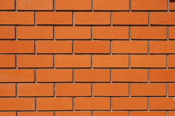 Texture of ideal new red brick wall.