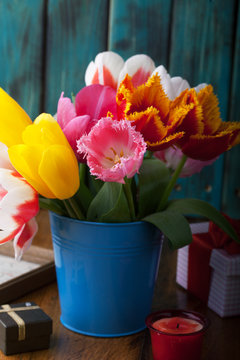 Beautiful bouquet of tulips on the table. Gift for a holiday.