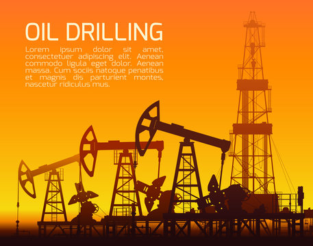 Drilling rigs and oil pumps at sunset