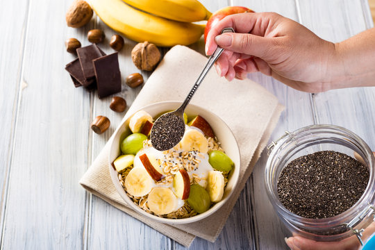 Bowl of cereal and chia seeds. Healthy breakfast.