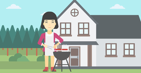 Woman cooking meat on barbecue grill.