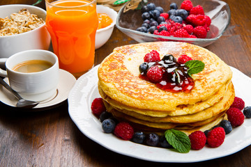 Pancakes with berries and maple syrup